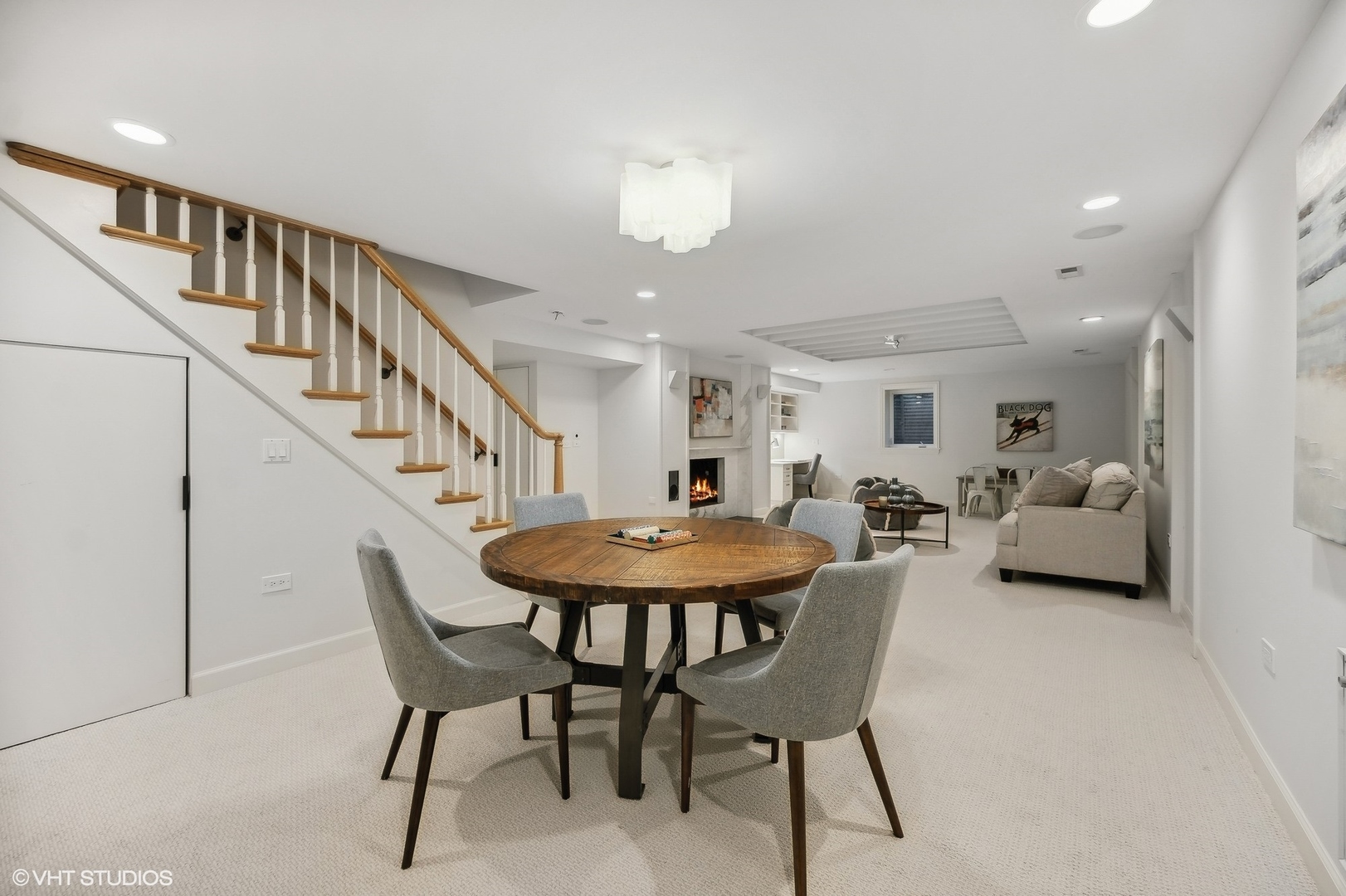 88 Abbotsford Road Winnetka, IL 60093 - Photo 39 of 46 a living room with furniture and a chandelier