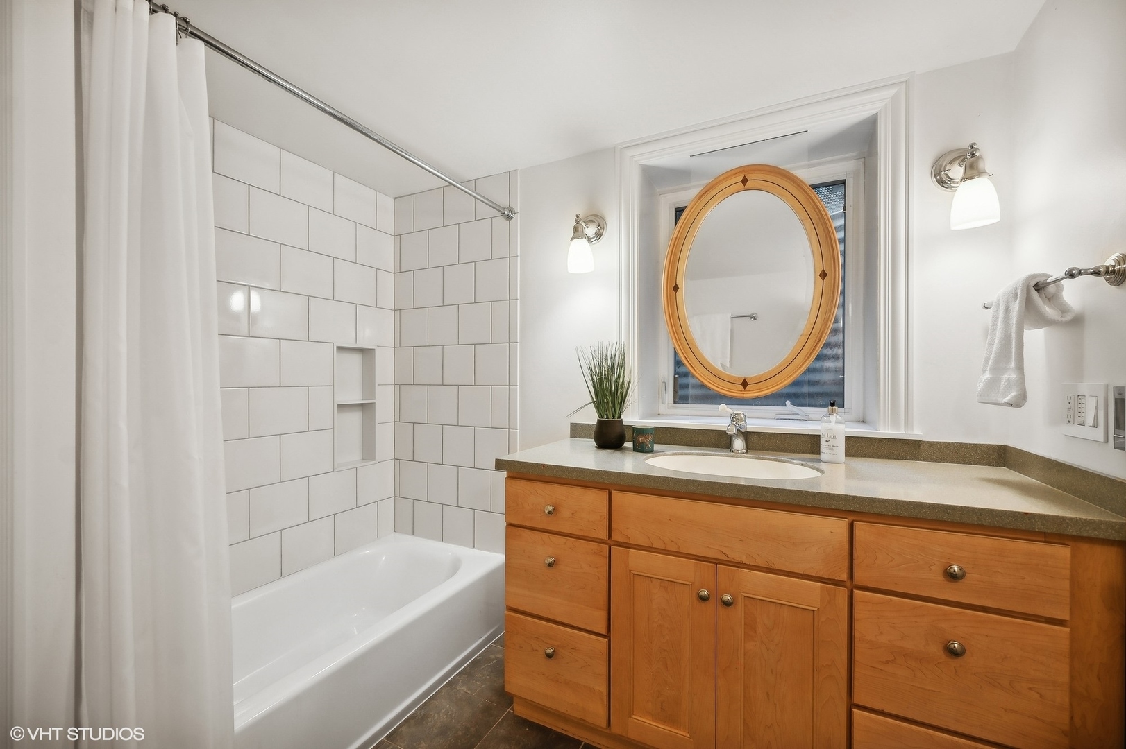 88 Abbotsford Road Winnetka, IL 60093 - Photo 41 of 46 a bathroom with a granite countertop sink a mirror a bathtub and shower