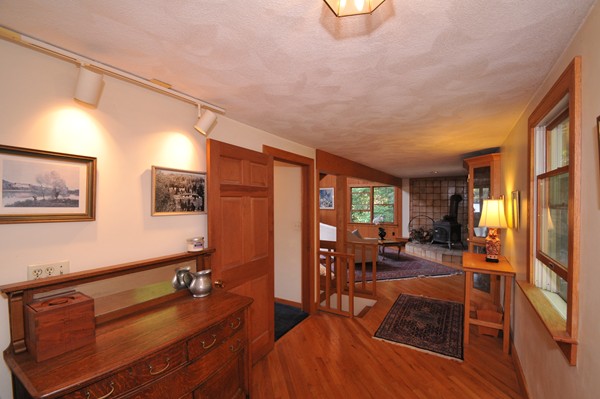 49 Shore Road Wellesley, MA 01760 - Photo 15 of 30 a living room with furniture a flat screen tv and large window