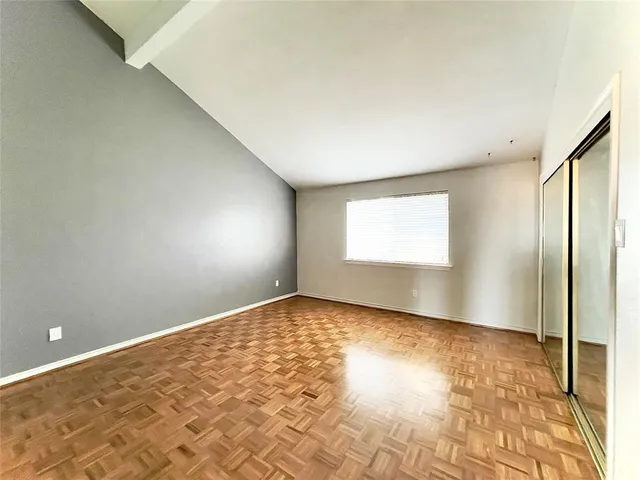 an empty room with a empty space and a window