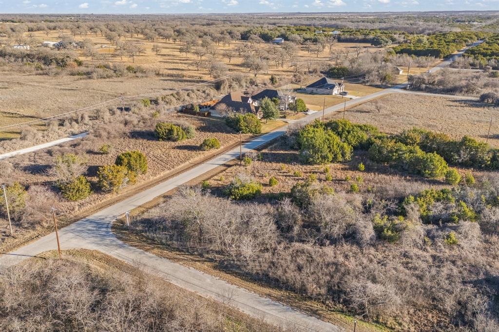 22212 Field Street Whitney, TX 76692 - Photo 16 of 32 an aerial view of residential houses with outdoor space