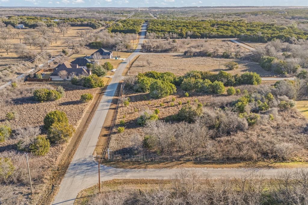 22212 Field Street Whitney, TX 76692 - Photo 18 of 32 an aerial view of residential houses with outdoor space