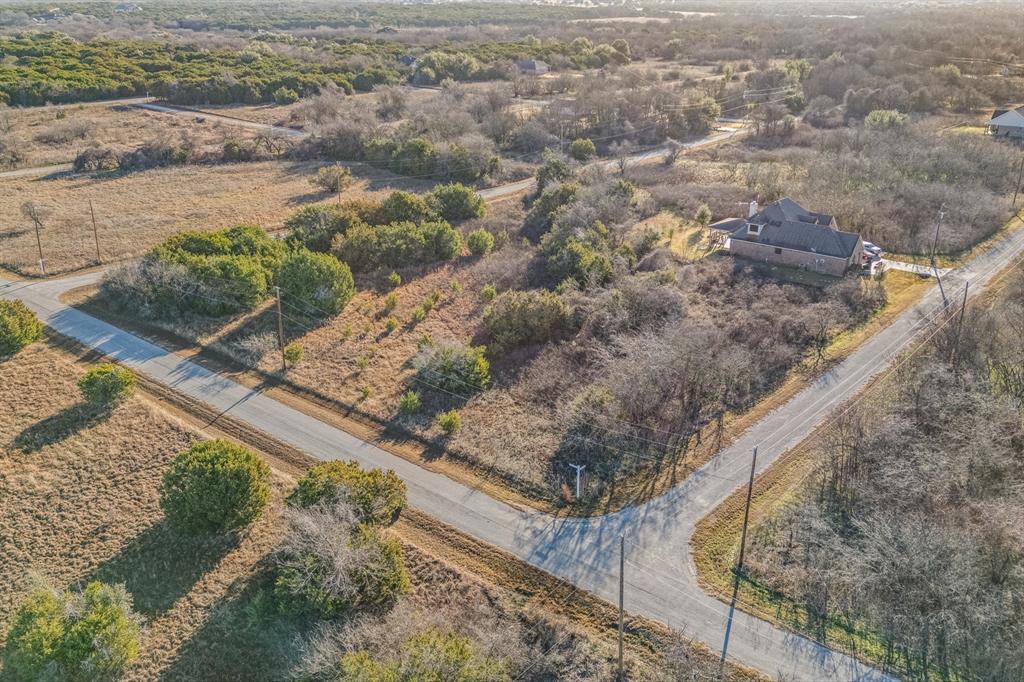22212 Field Street Whitney, TX 76692 - Photo 20 of 32 a view of a yard with wooden fence