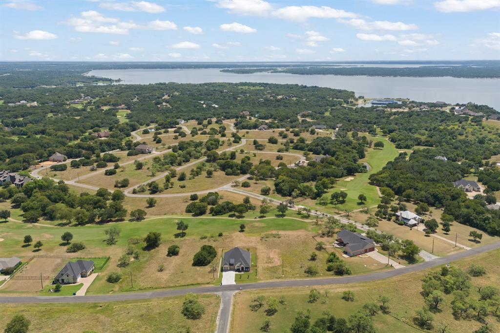 22212 Field Street Whitney, TX 76692 - Photo 3 of 32 an aerial view of residential houses with outdoor space