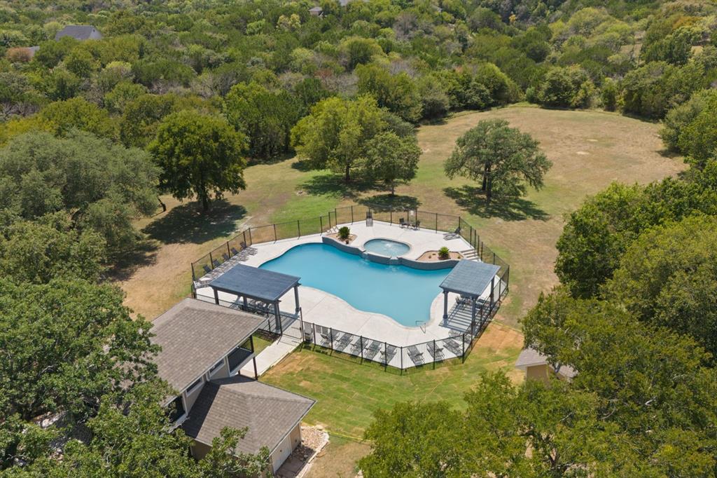 22212 Field Street Whitney, TX 76692 - Photo 7 of 32 a view of a house with a yard