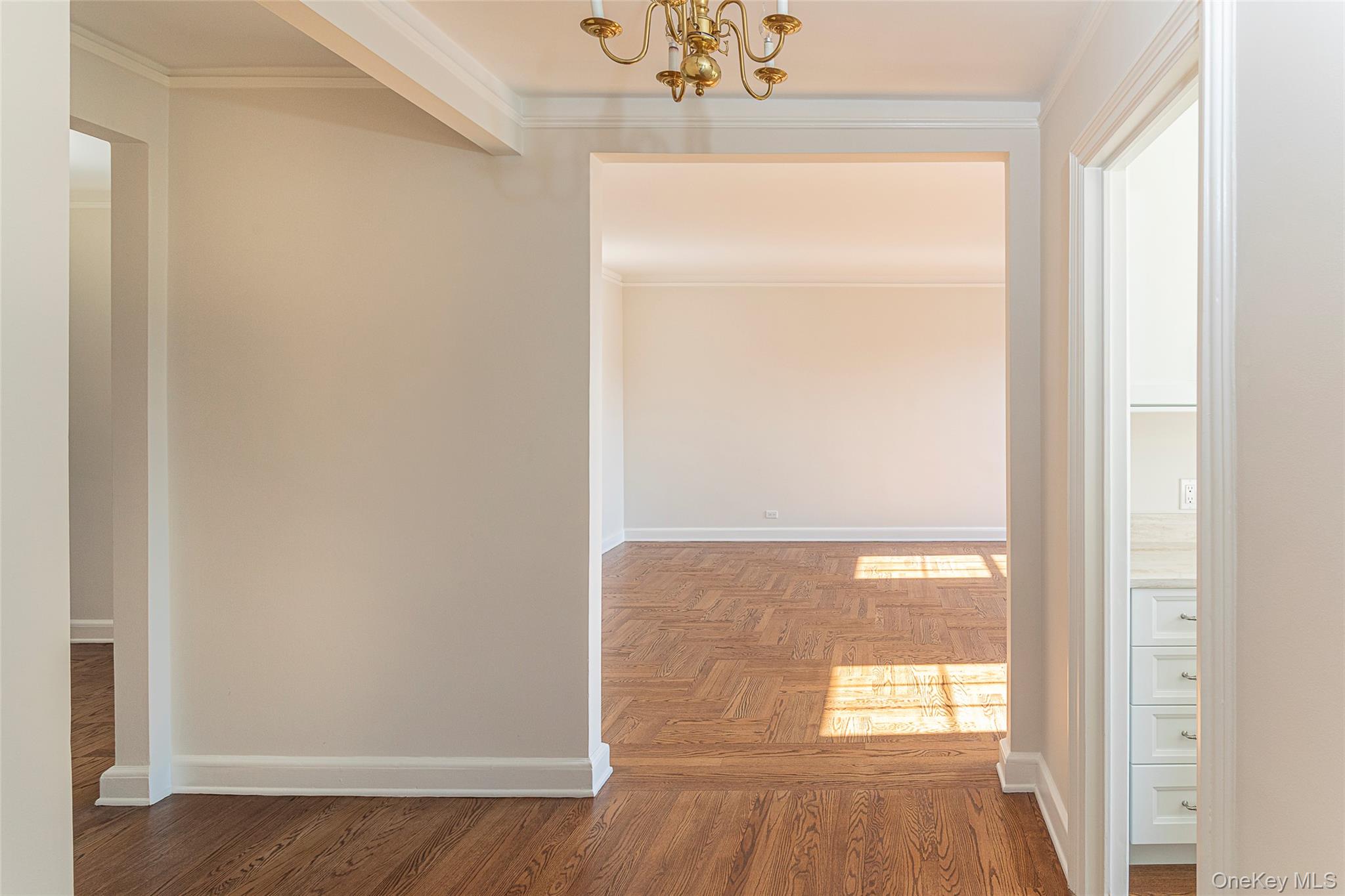 6 Midland Gardens, Unit 4B Bronxville, NY 10708 - Photo 12 of 16 a view of empty room with wooden floor and fan