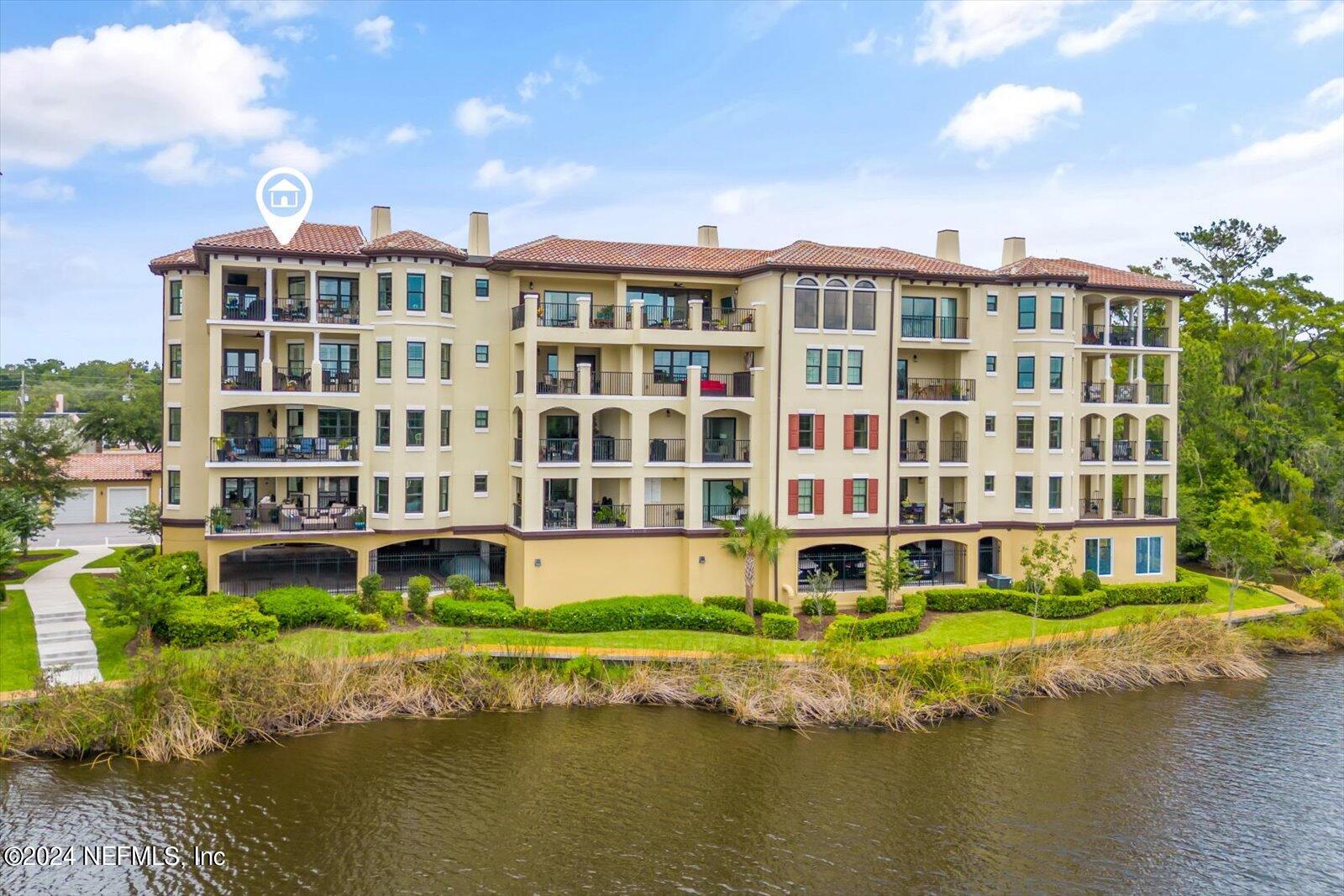 3958 Baymeadows Road, Unit 4501 Jacksonville, FL 32217 - Photo 1 of 57 a front view of a building with a garden and swimming pool