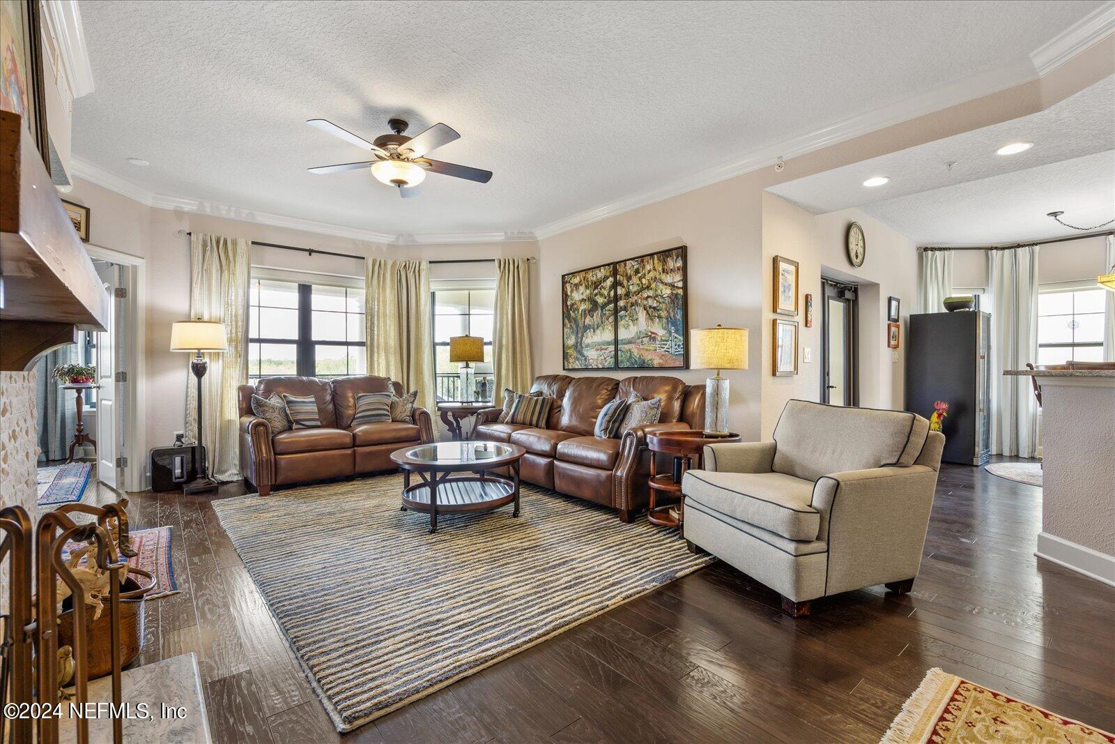 3958 Baymeadows Road, Unit 4501 Jacksonville, FL 32217 - Photo 14 of 57 a living room with furniture and a chandelier