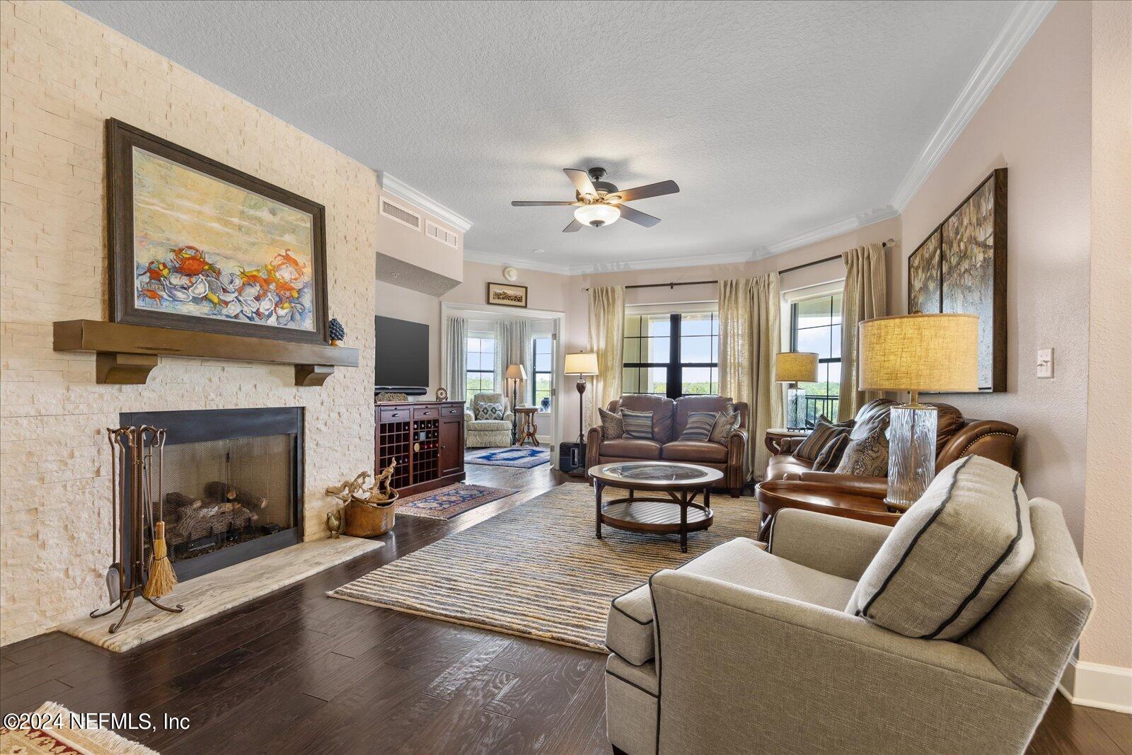 3958 Baymeadows Road, Unit 4501 Jacksonville, FL 32217 - Photo 15 of 57 a living room with furniture and a fireplace