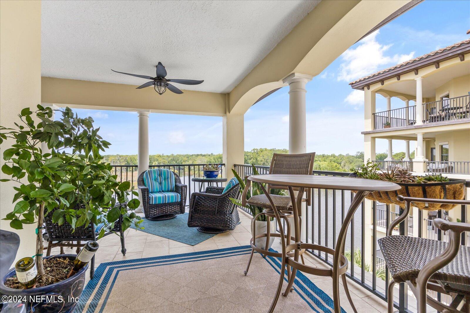 3958 Baymeadows Road, Unit 4501 Jacksonville, FL 32217 - Photo 28 of 57 a balcony view with couple of chairs and potted plants