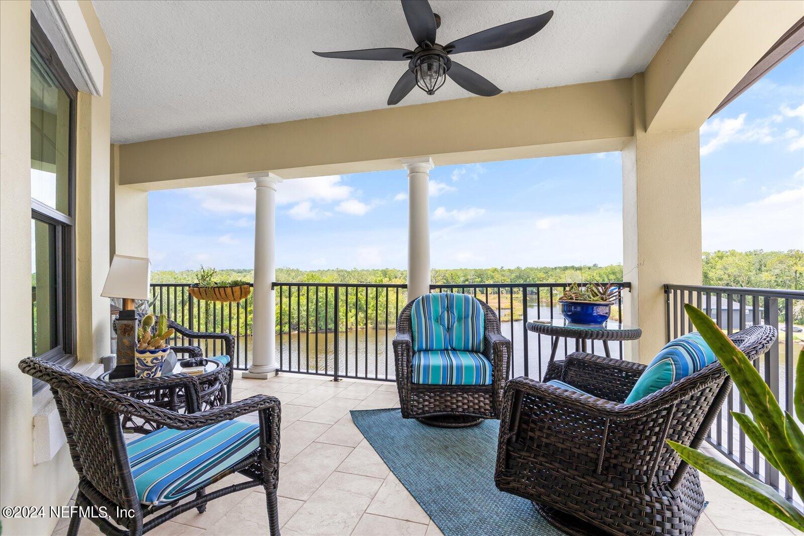 3958 Baymeadows Road, Unit 4501 Jacksonville, FL 32217 - Photo 29 of 57 a living room with furniture and a floor to ceiling window