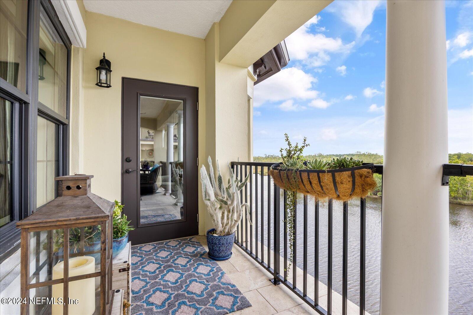 3958 Baymeadows Road, Unit 4501 Jacksonville, FL 32217 - Photo 33 of 57 a view of a balcony with furniture and floor to ceiling window