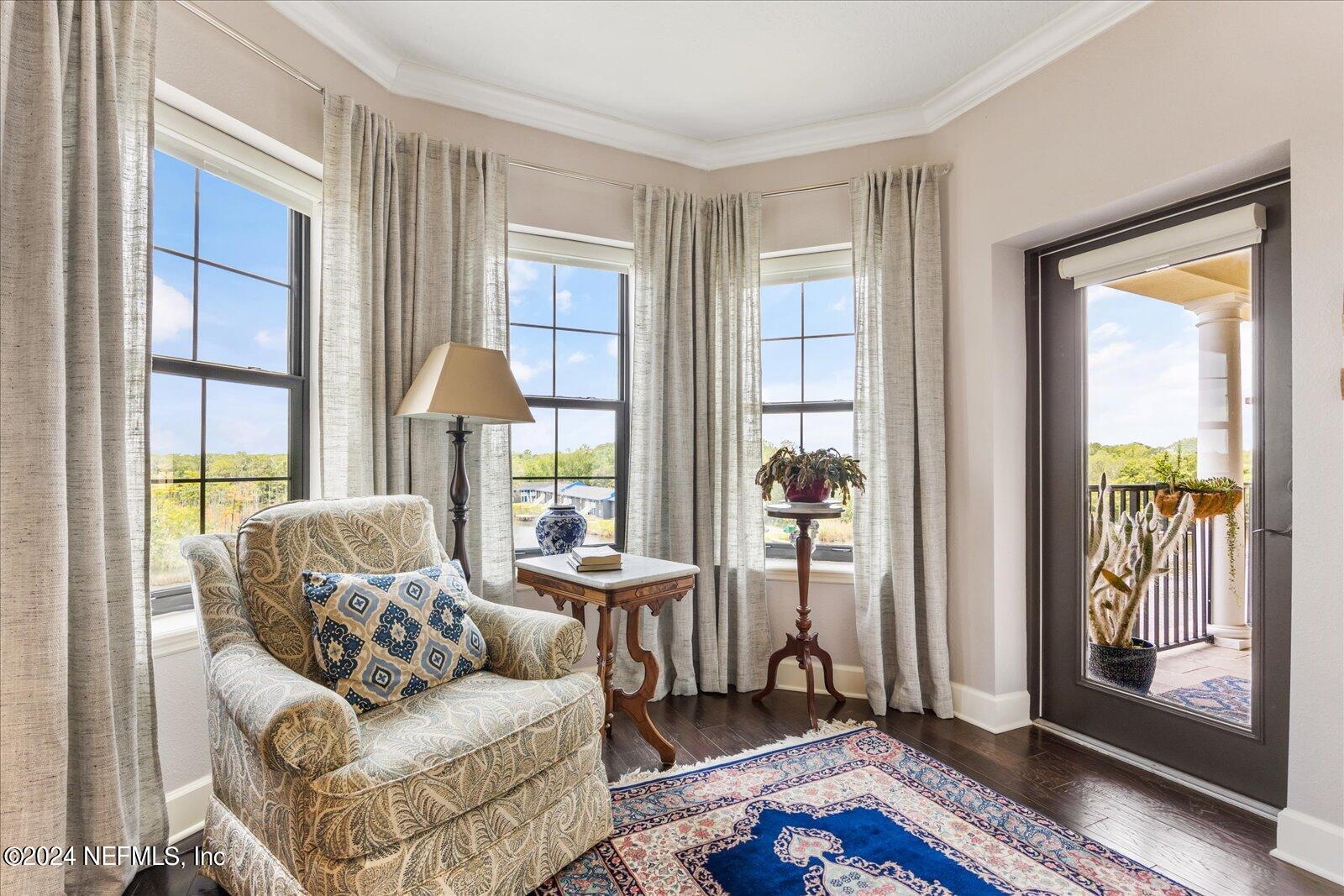 3958 Baymeadows Road, Unit 4501 Jacksonville, FL 32217 - Photo 34 of 57 a living room with furniture and large windows