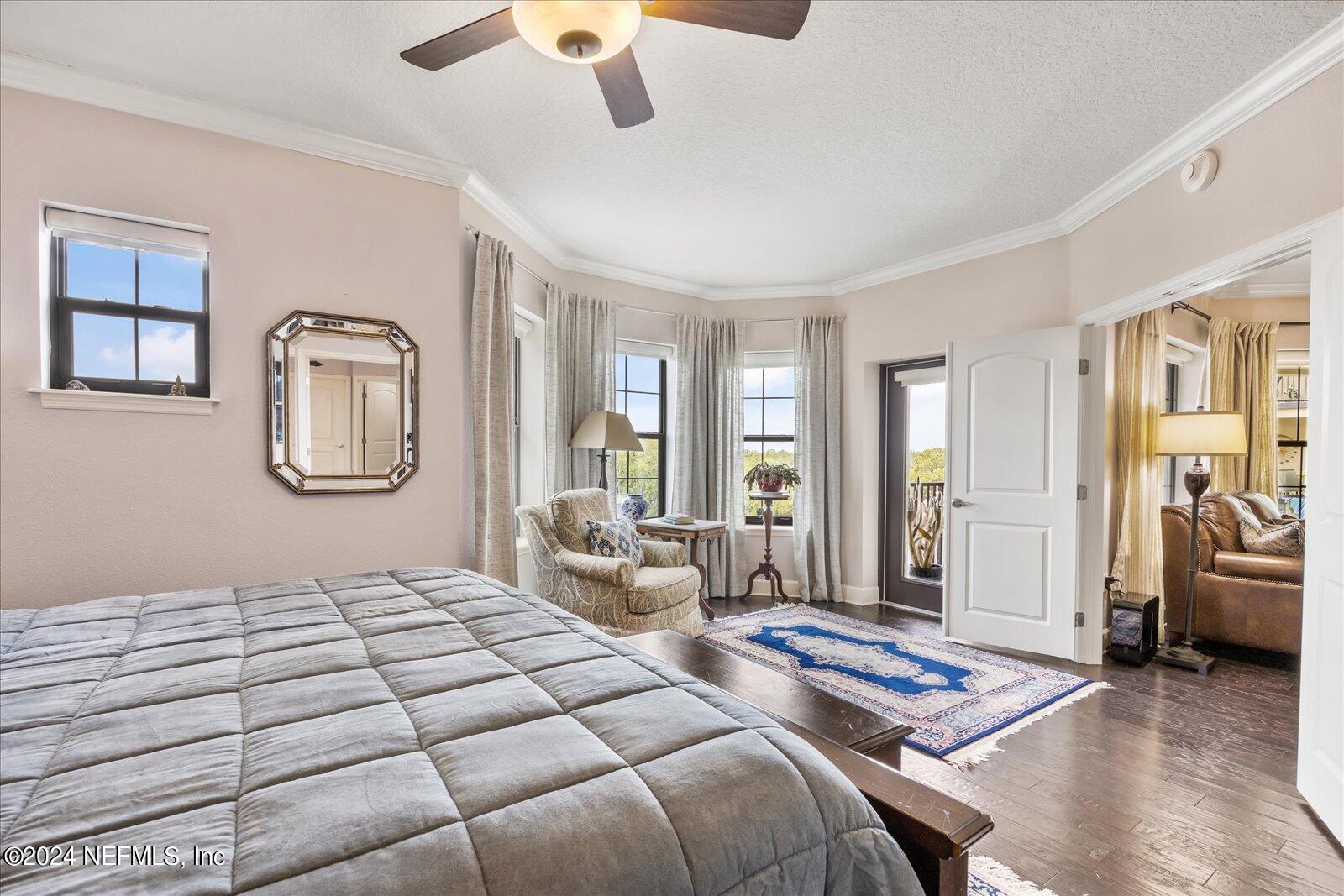 3958 Baymeadows Road, Unit 4501 Jacksonville, FL 32217 - Photo 35 of 57 a bedroom with a bed mirror and window