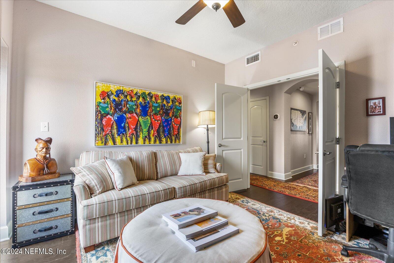 3958 Baymeadows Road, Unit 4501 Jacksonville, FL 32217 - Photo 50 of 57 a living room with furniture and a rug
