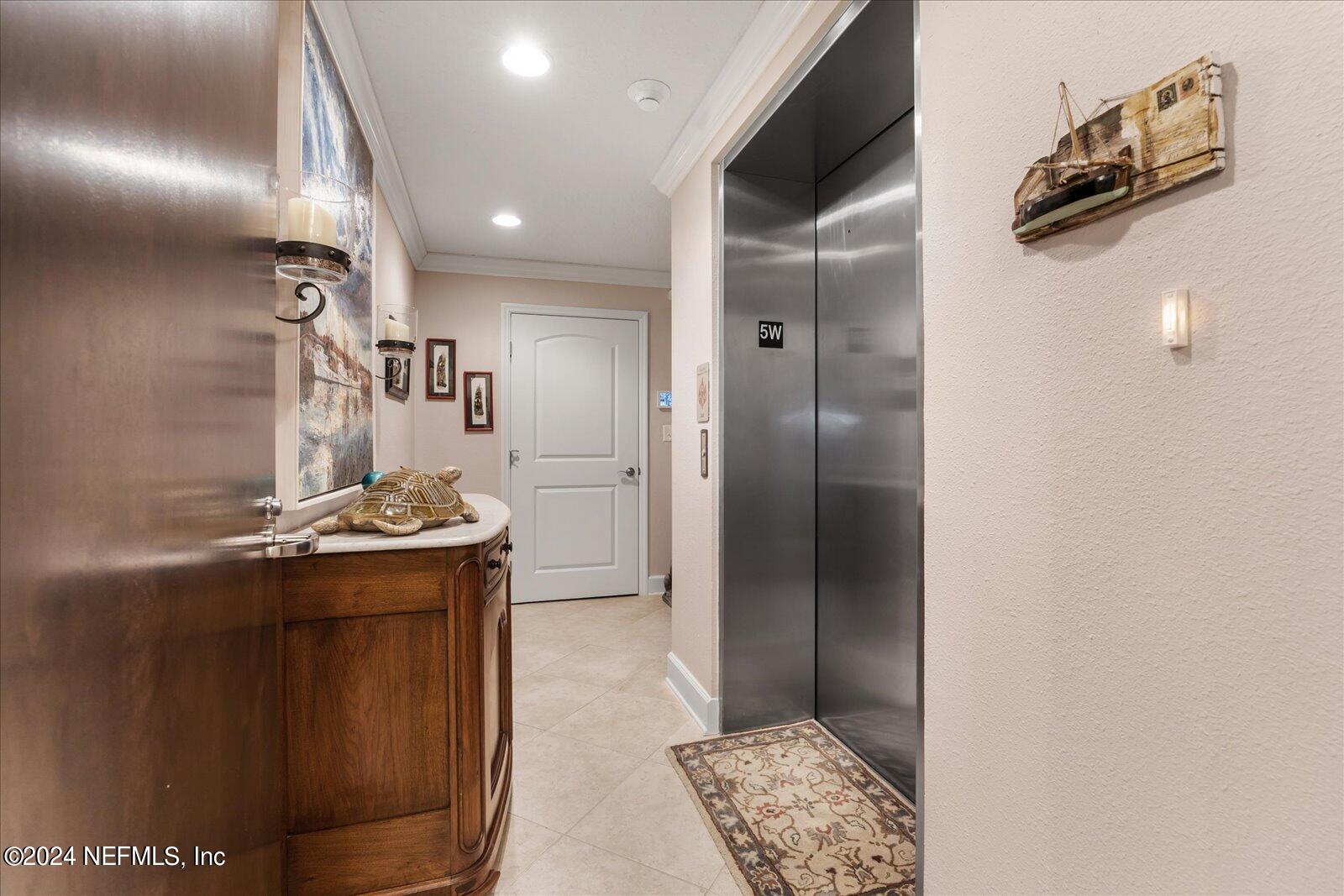 3958 Baymeadows Road, Unit 4501 Jacksonville, FL 32217 - Photo 10 of 57 a kitchen with granite countertop a sink and a refrigerator