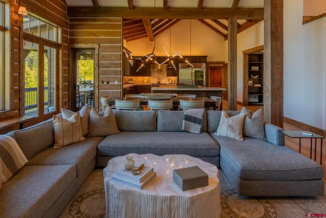 a kitchen with a wooden table and chairs
