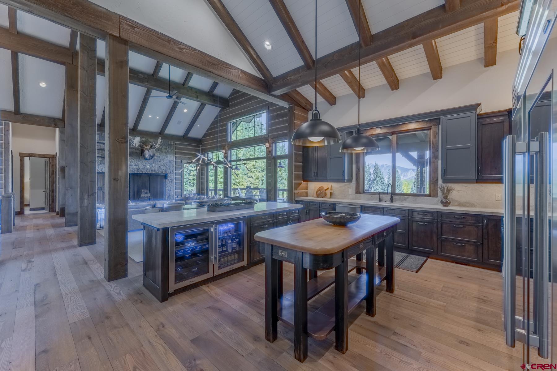 1610 Red Mountain Ranch Road Crested Butte, CO 81224 - Photo 13 of 35 a kitchen with a wooden table and chairs
