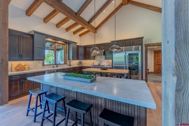 a kitchen with a table and chairs