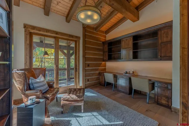 a view of a chairs and table on the wooden floor