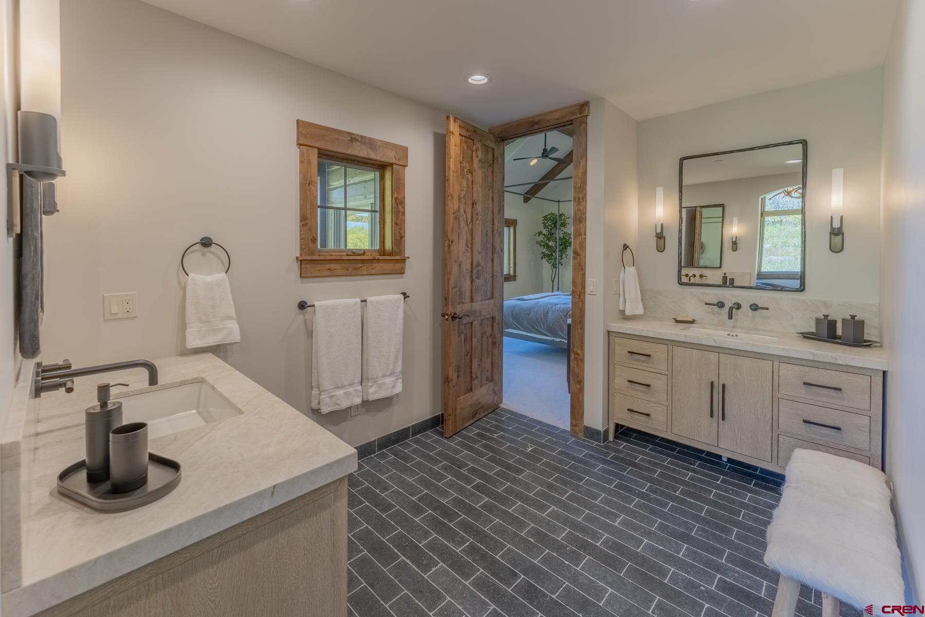 1610 Red Mountain Ranch Road Crested Butte, CO 81224 - Photo 23 of 35 a bathroom with a sink double vanity and a mirror