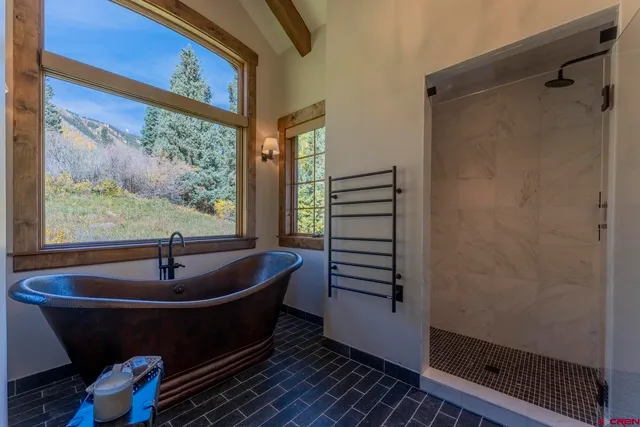 a bedroom with a bed and a television