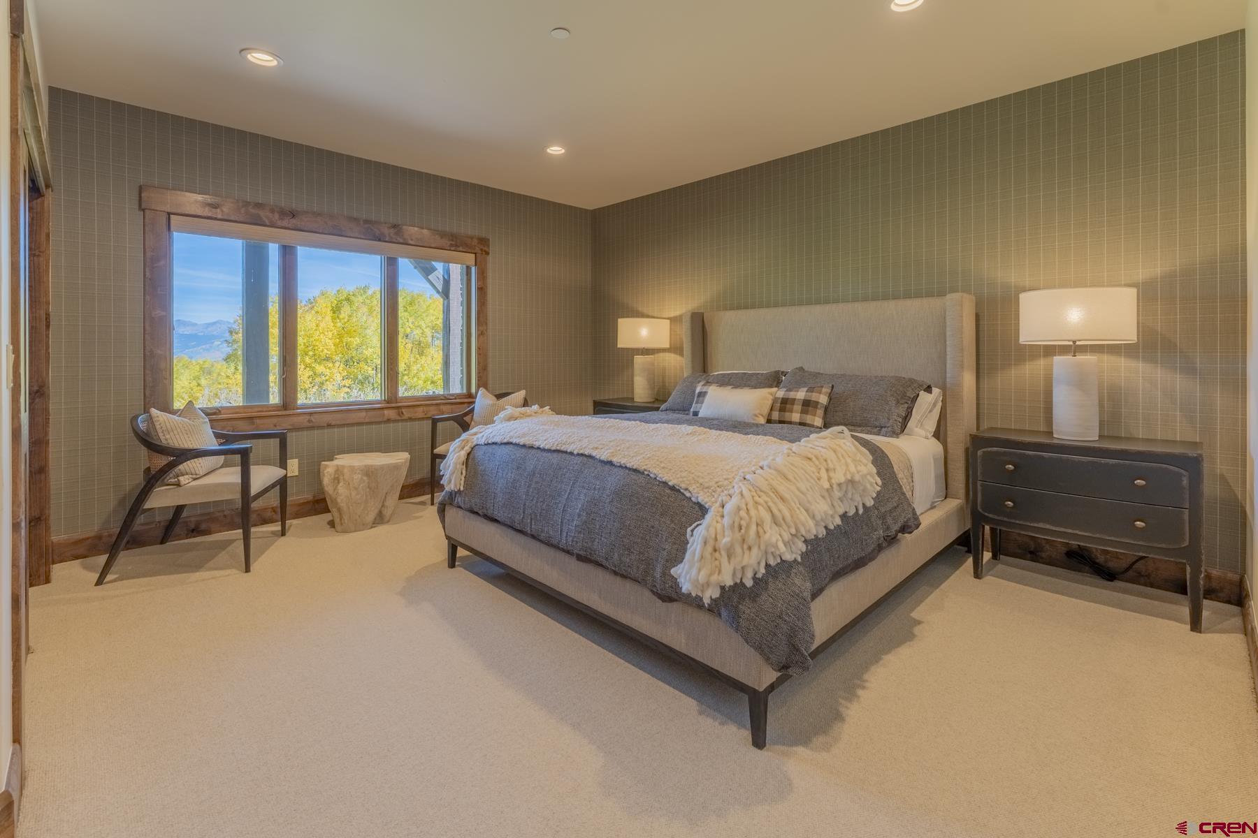 1610 Red Mountain Ranch Road Crested Butte, CO 81224 - Photo 30 of 35 a bedroom with a bed and a table in it