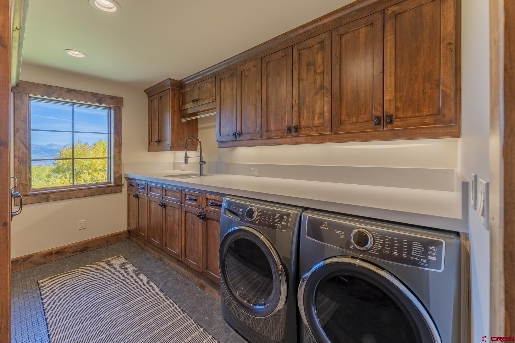 1610 Red Mountain Ranch Road Crested Butte, CO 81224 - Photo 35 of 35 a utility room with dryer and washer