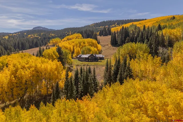 a view of a large body of water with a building in the background