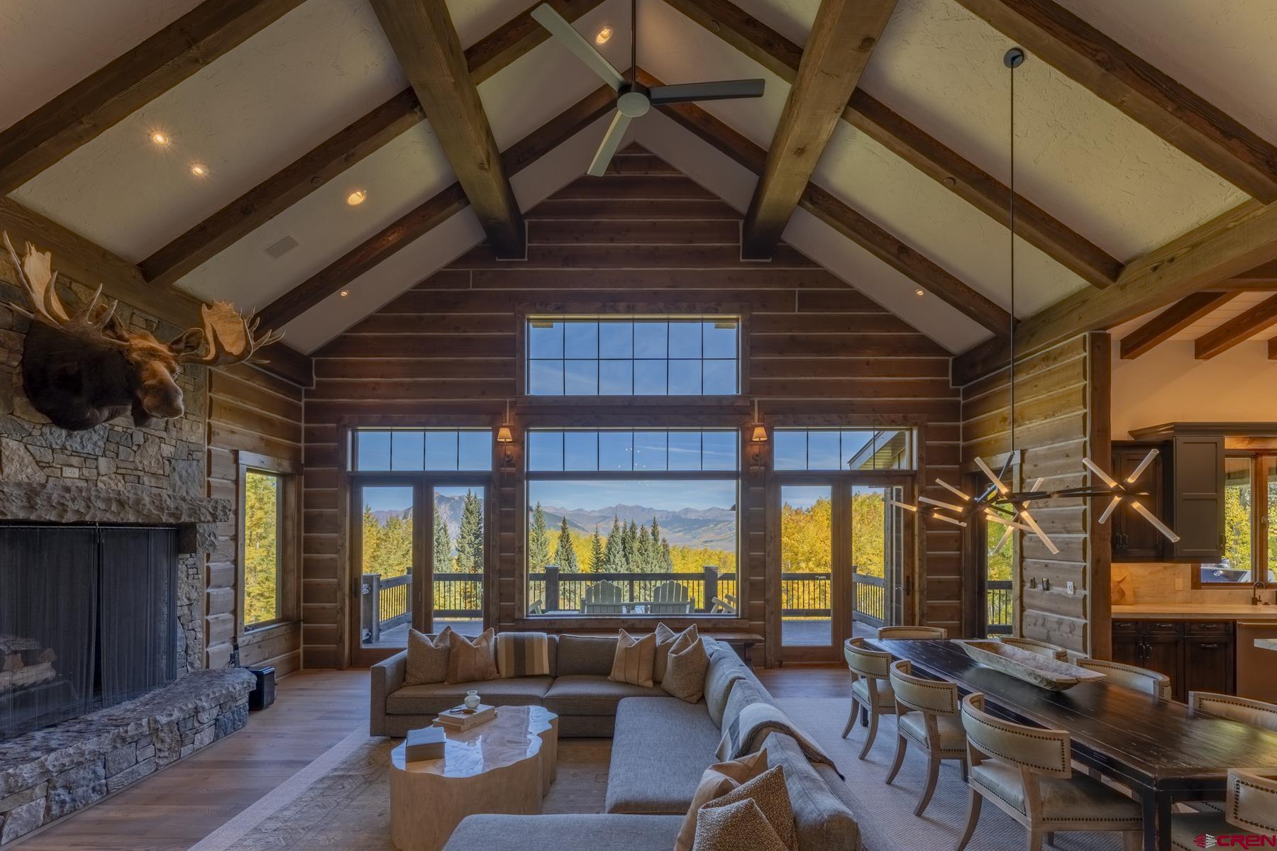 1610 Red Mountain Ranch Road Crested Butte, CO 81224 - Photo 9 of 35 a living room with furniture a fireplace and a flat screen tv