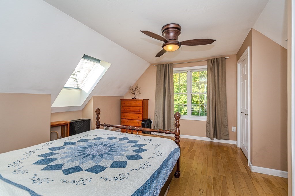 193 Acropolis Road Lowell, MA 01854 - Photo 23 of 39 a bed room with a bed and a television