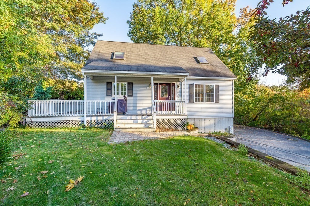 193 Acropolis Road Lowell, MA 01854 - Photo 4 of 39 a view of a house with a yard and sitting area