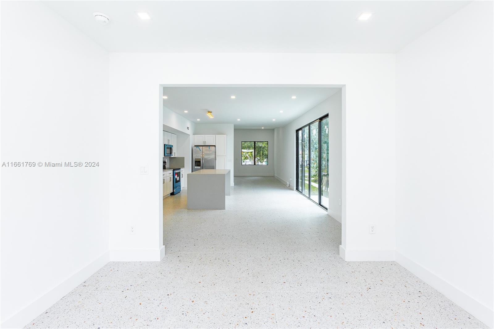 170 Southwest 38th Court Miami, FL 33134 - Photo 31 of 37 a view of a hallway with wooden floor and a bathroom