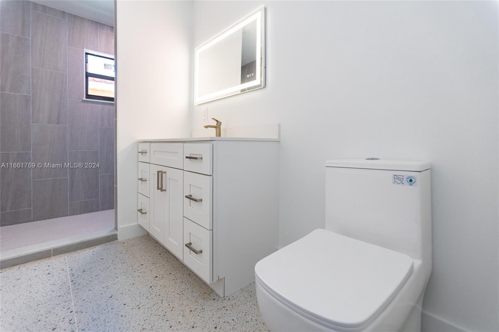 170 Southwest 38th Court Miami, FL 33134 - Photo 34 of 37 a bathroom with a toilet a sink and shower