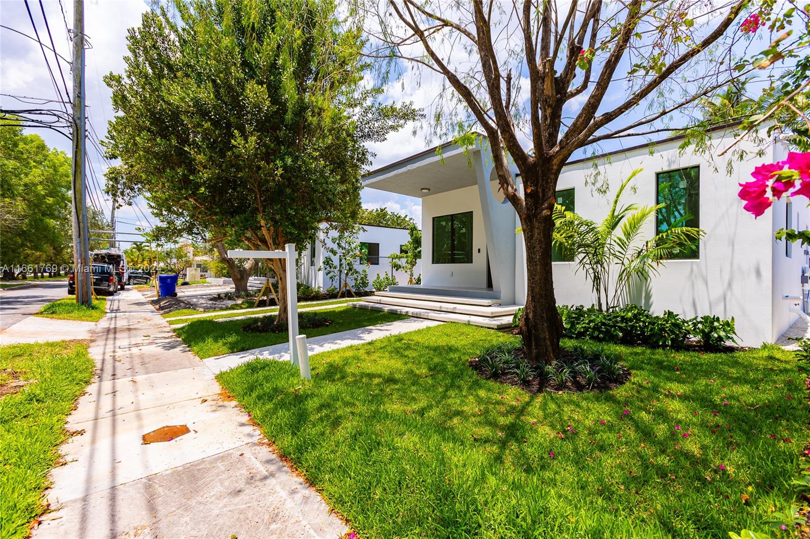 170 Southwest 38th Court Miami, FL 33134 - Photo 8 of 37 a view of a house with backyard and a tree