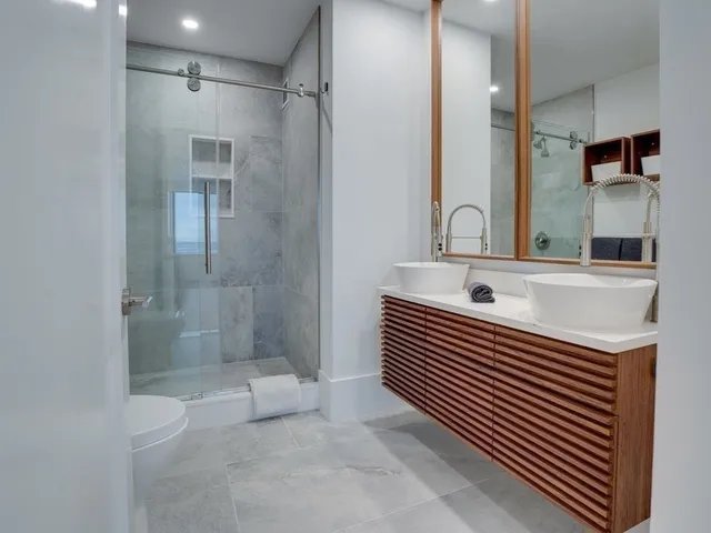 a bathroom with a sink a mirror and a bathtub