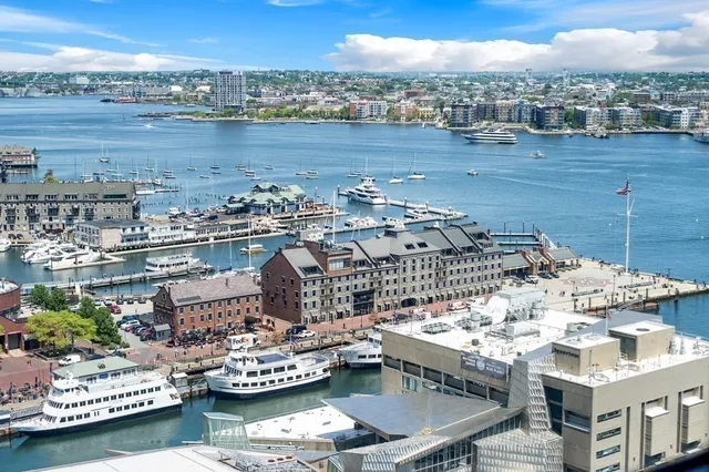 a view of a lake with tall building