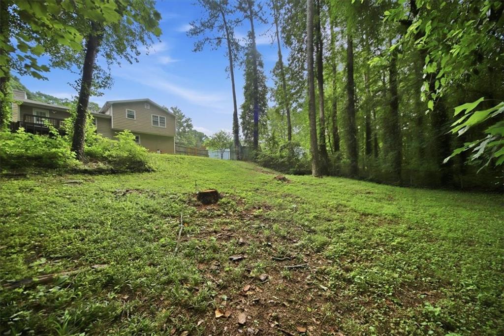 1496 Cherry Hill Road Southwest Conyers, GA 30094 - Photo 29 of 32 a view of a backyard of the house
