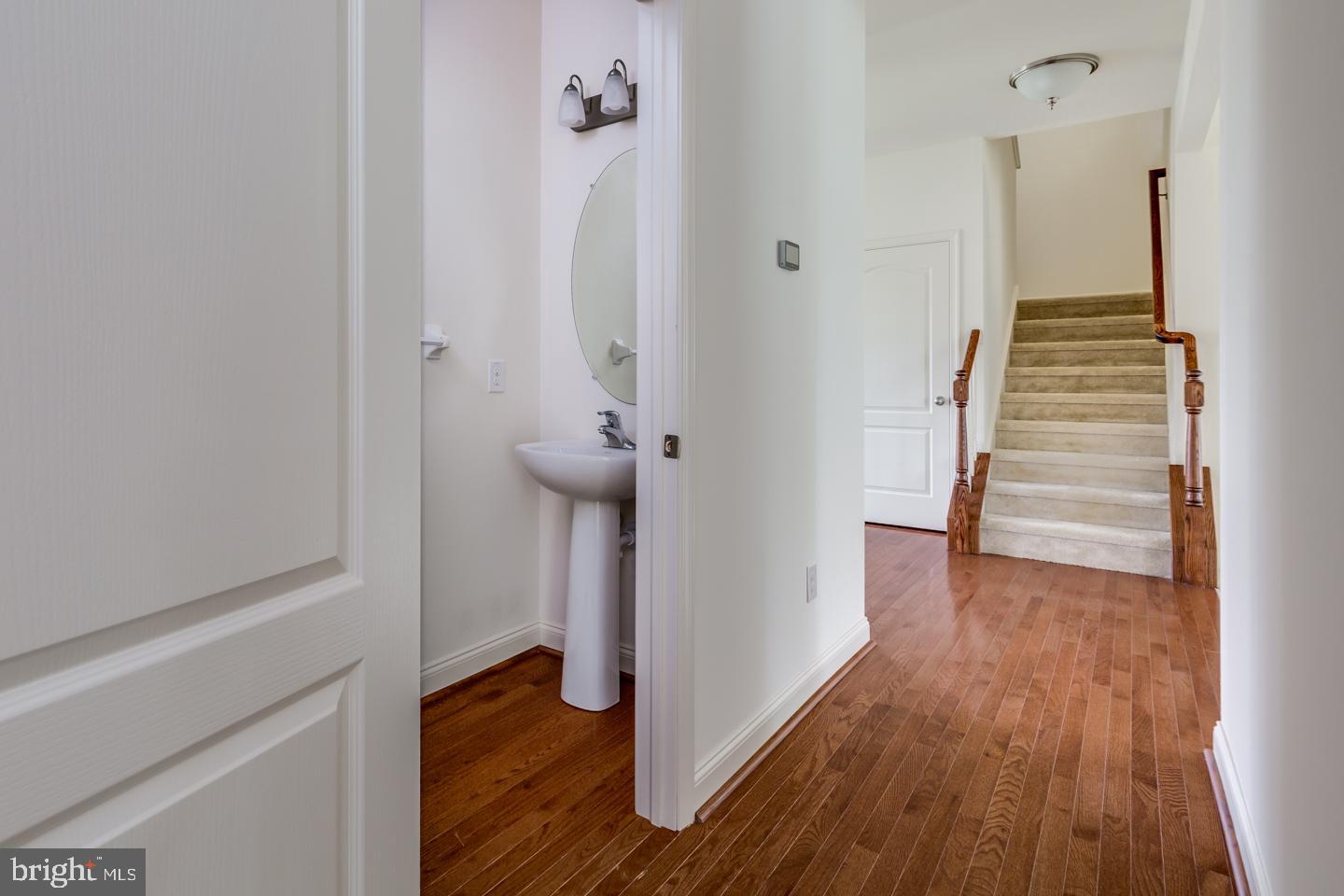 487 Mullica Hill Road Mullica Hill, NJ 08062 - Photo 11 of 17 a view of a hallway with wooden floor and staircase