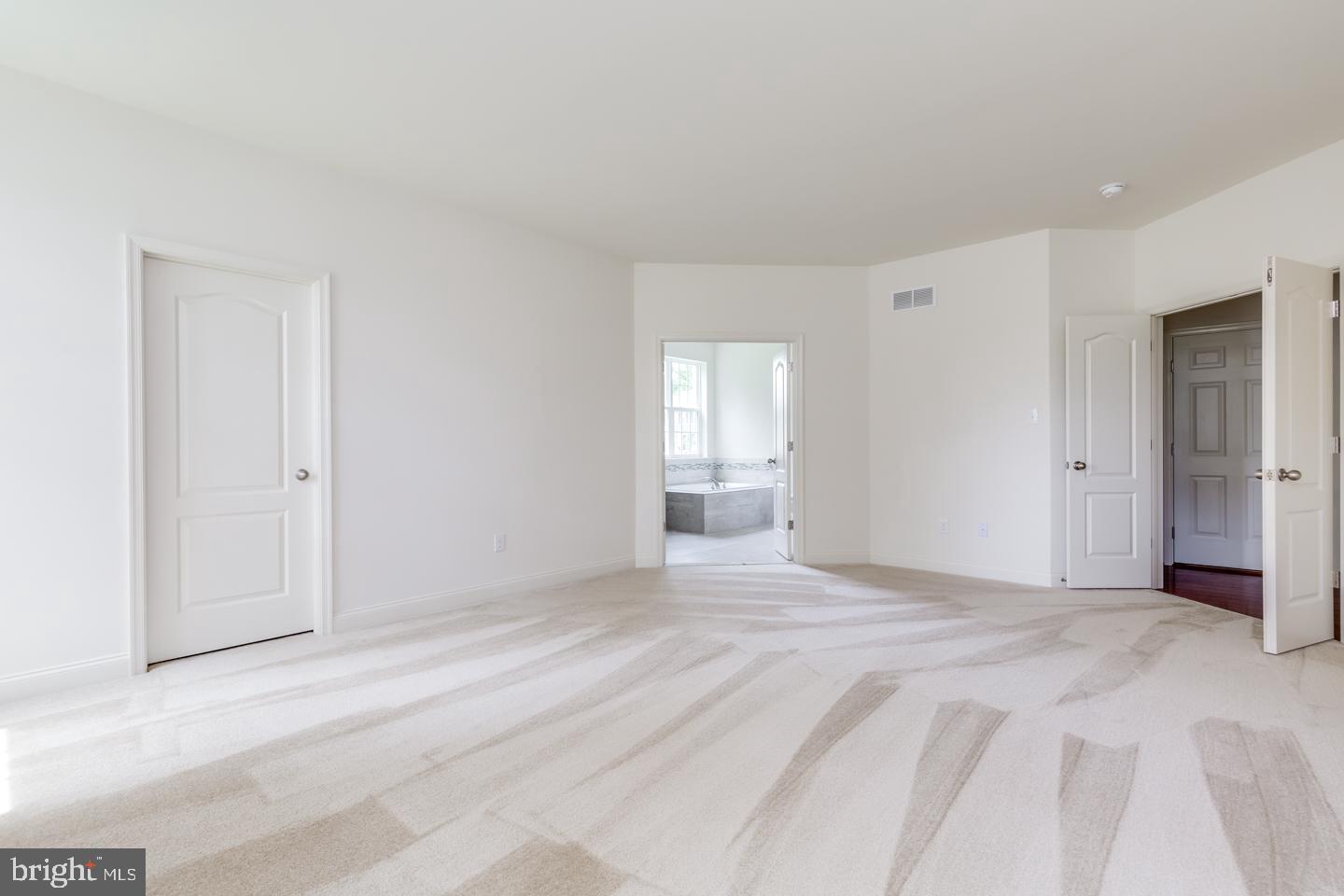 487 Mullica Hill Road Mullica Hill, NJ 08062 - Photo 14 of 17 a view of an empty room with window and wooden floor