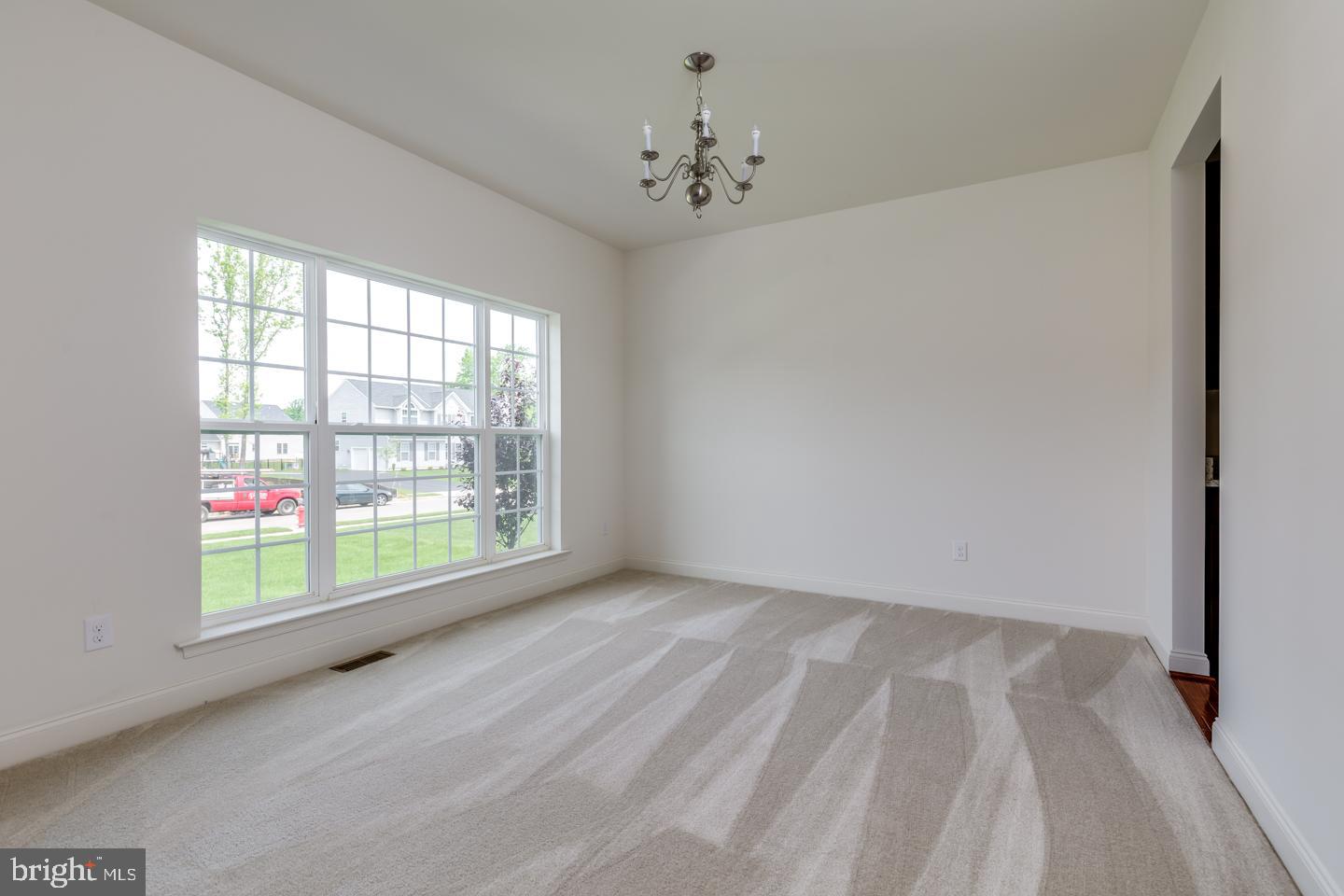487 Mullica Hill Road Mullica Hill, NJ 08062 - Photo 3 of 17 wooden floor in an empty room with a window