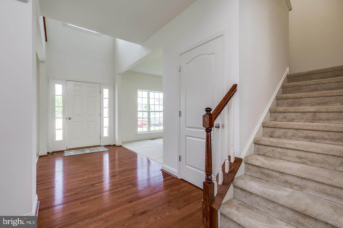 487 Mullica Hill Road Mullica Hill, NJ 08062 - Photo 4 of 17 a view of an entryway with wooden floor and staircase