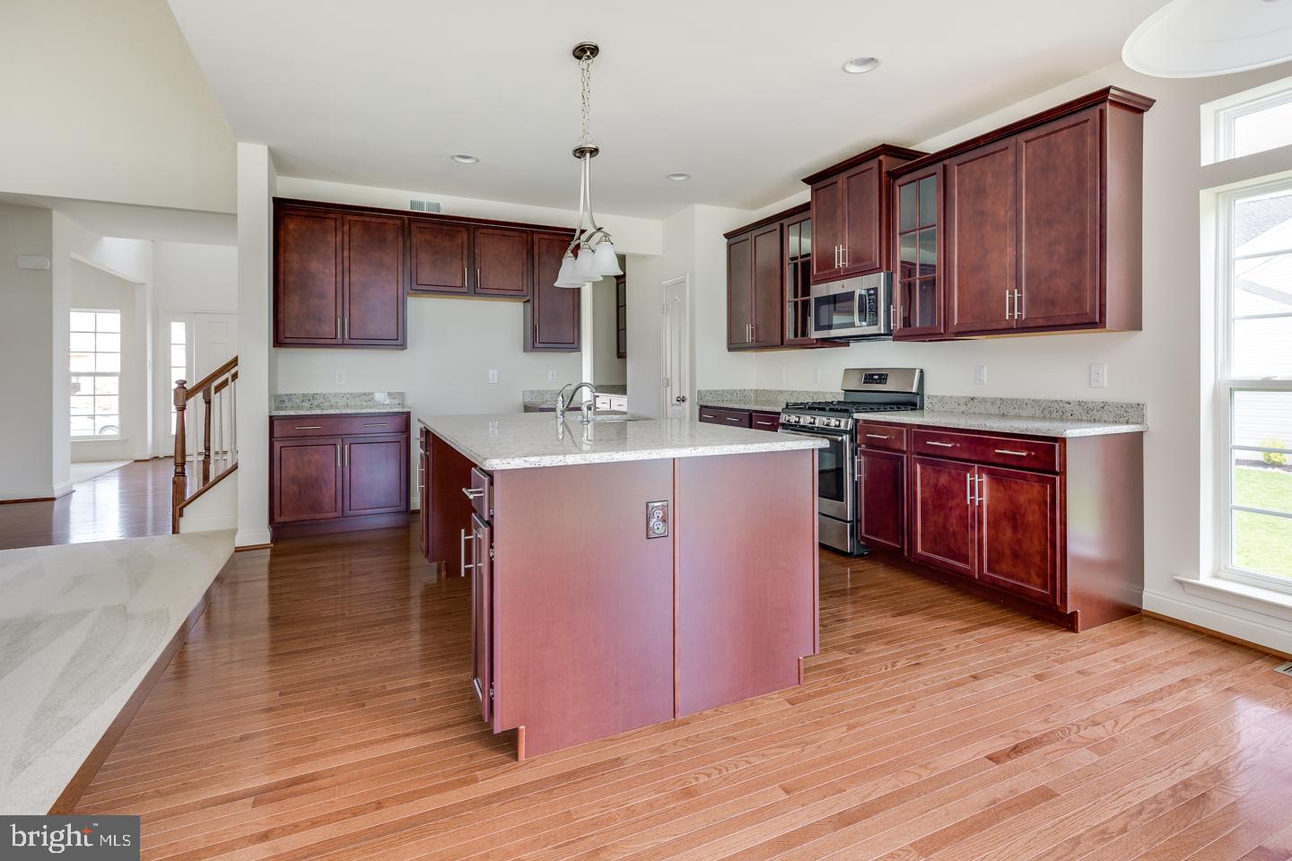 487 Mullica Hill Road Mullica Hill, NJ 08062 - Photo 8 of 17 a kitchen with stainless steel appliances granite countertop wooden cabinets a sink dishwasher a stove and a refrigerator