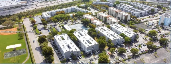 a view of a house with swimming pool and sitting area