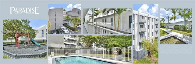 a view of a house with brick walls plants and large tree