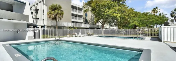a view of street along with parked cars