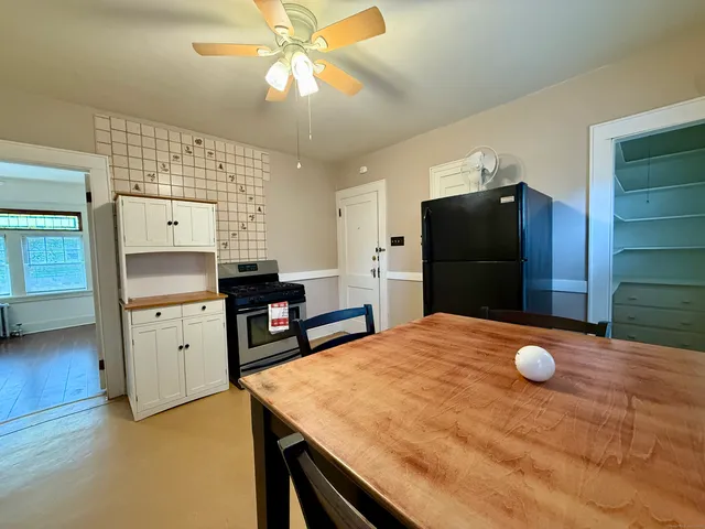 a kitchen with cabinets and stainless steel appliances