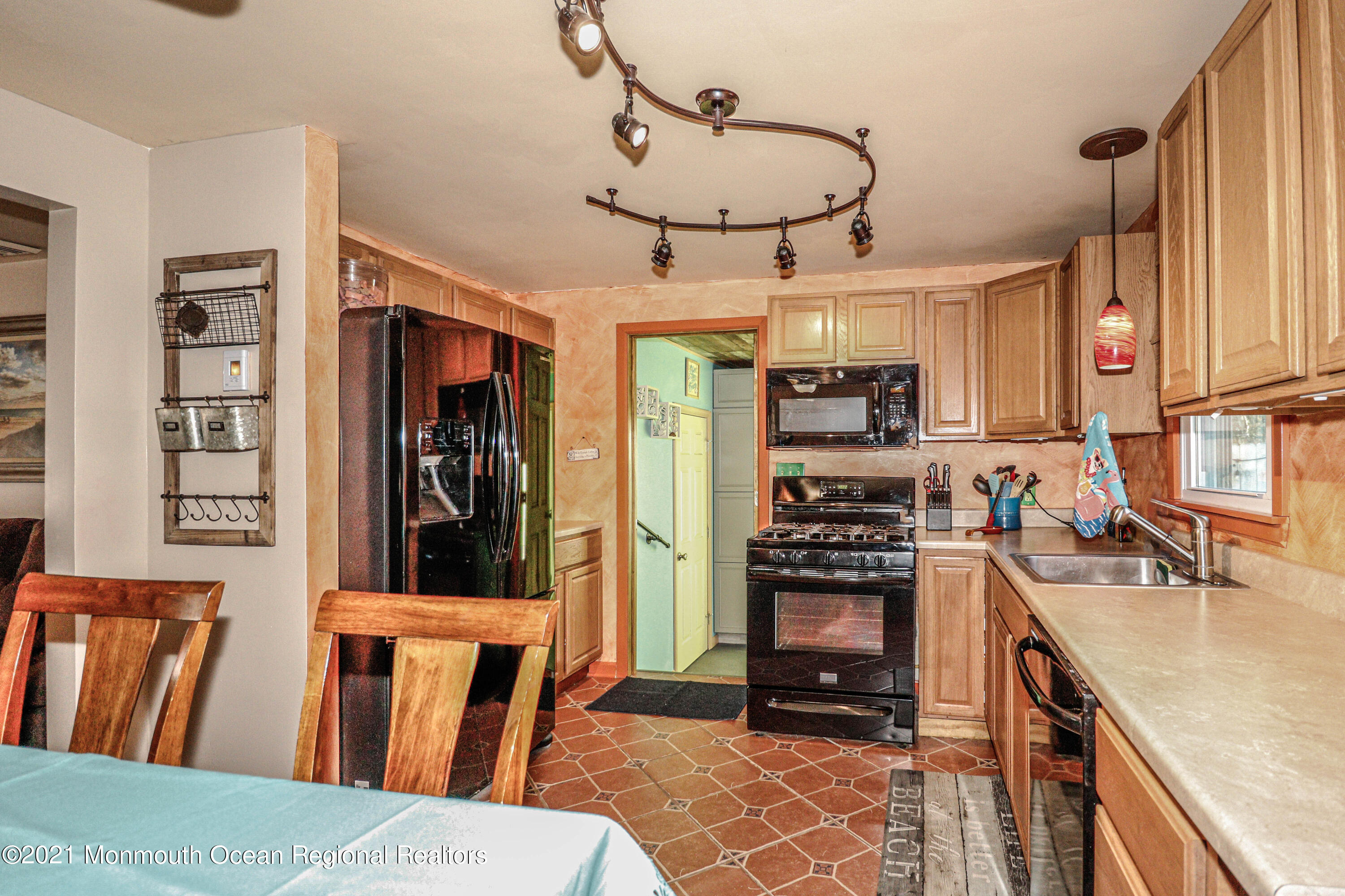 94 London Road Brick, NJ 08723 - Photo 11 of 43 a kitchen with stainless steel appliances granite countertop a stove refrigerator and a sink