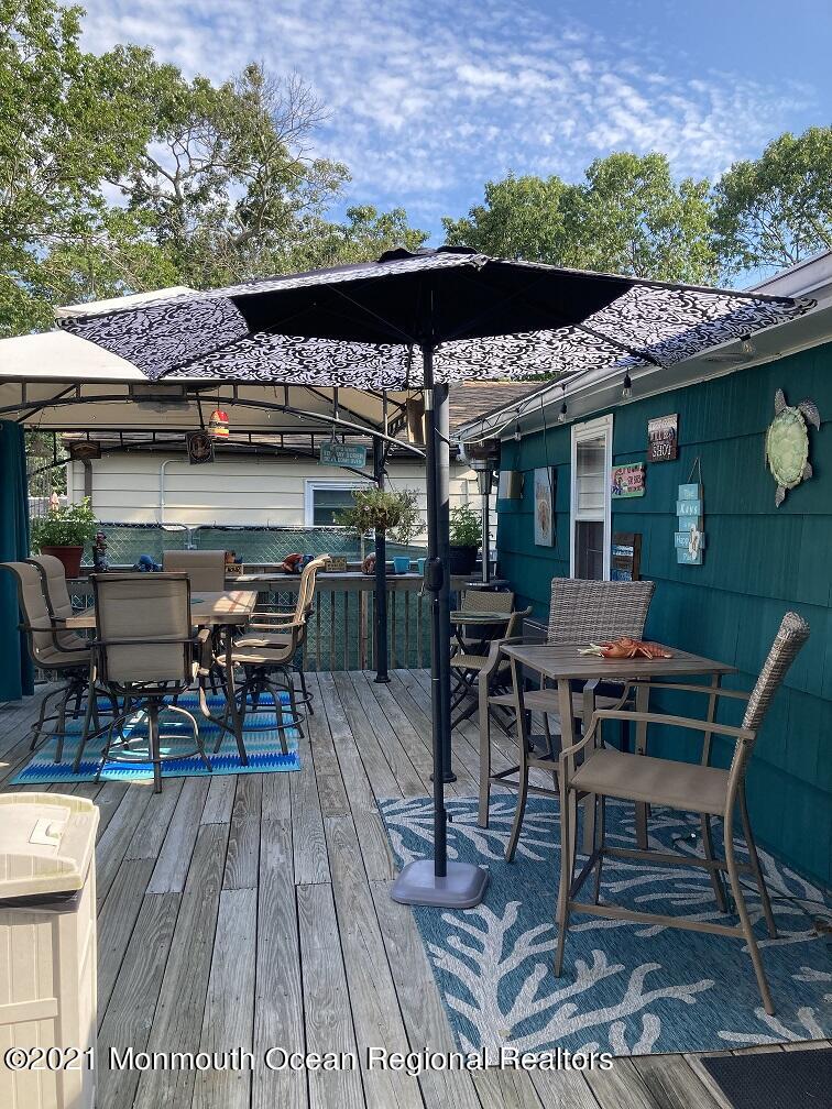 94 London Road Brick, NJ 08723 - Photo 34 of 43 a view of a chairs and table in a patio