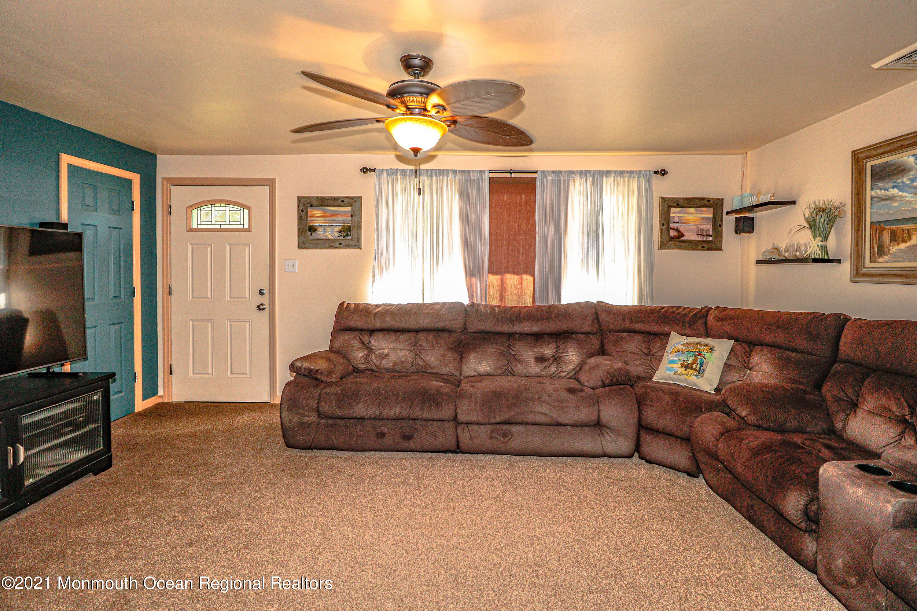 94 London Road Brick, NJ 08723 - Photo 7 of 43 a living room with furniture and a flat screen tv